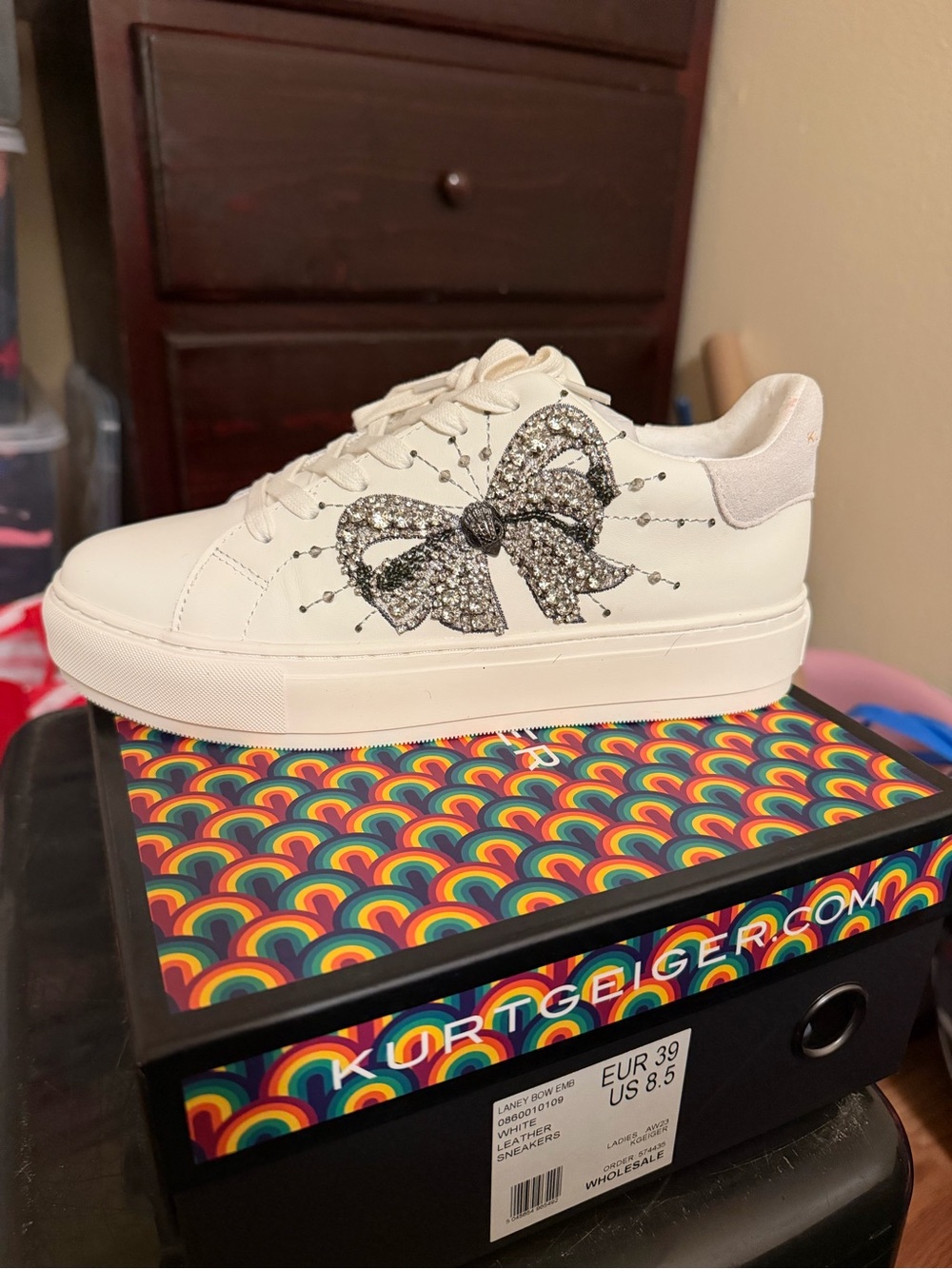 Kurt Geiger Women’s White Sneaker with Crystal Bow Detail